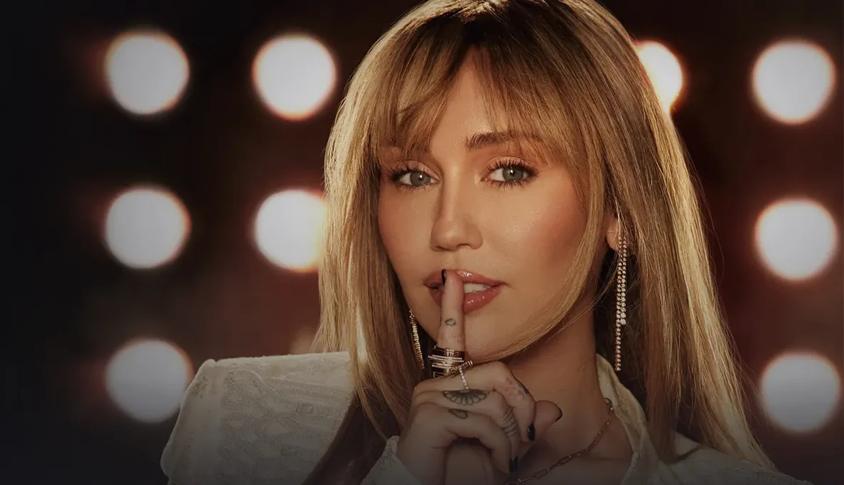 Miley Cyrus at the Hannah Montana 20th Anniversary Special premiere in a black gown