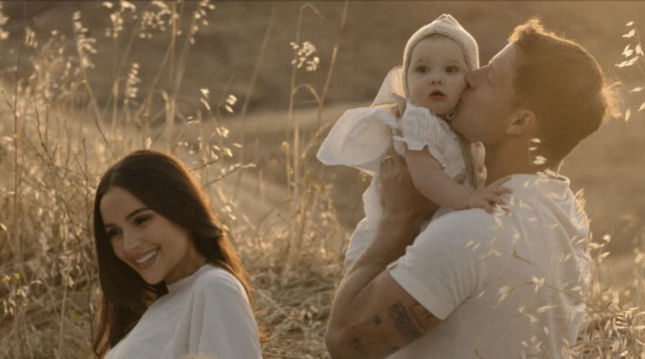 Olivia Culpo baby announcement picnic photo with Christian McCaffrey and daughter Colette