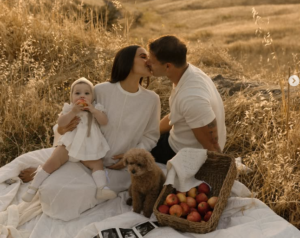 Olivia Culpo baby announcement picnic photo with Christian McCaffrey and daughter Colette